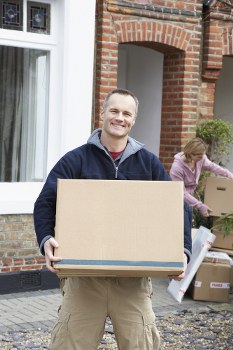 Professional packers handling boxes during a move